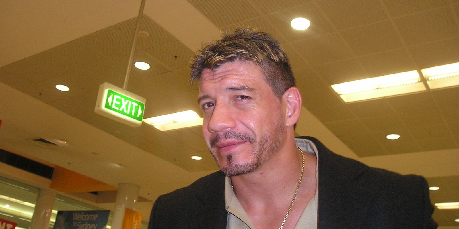 Eddie Guerrero posing in the ring during a WWE event