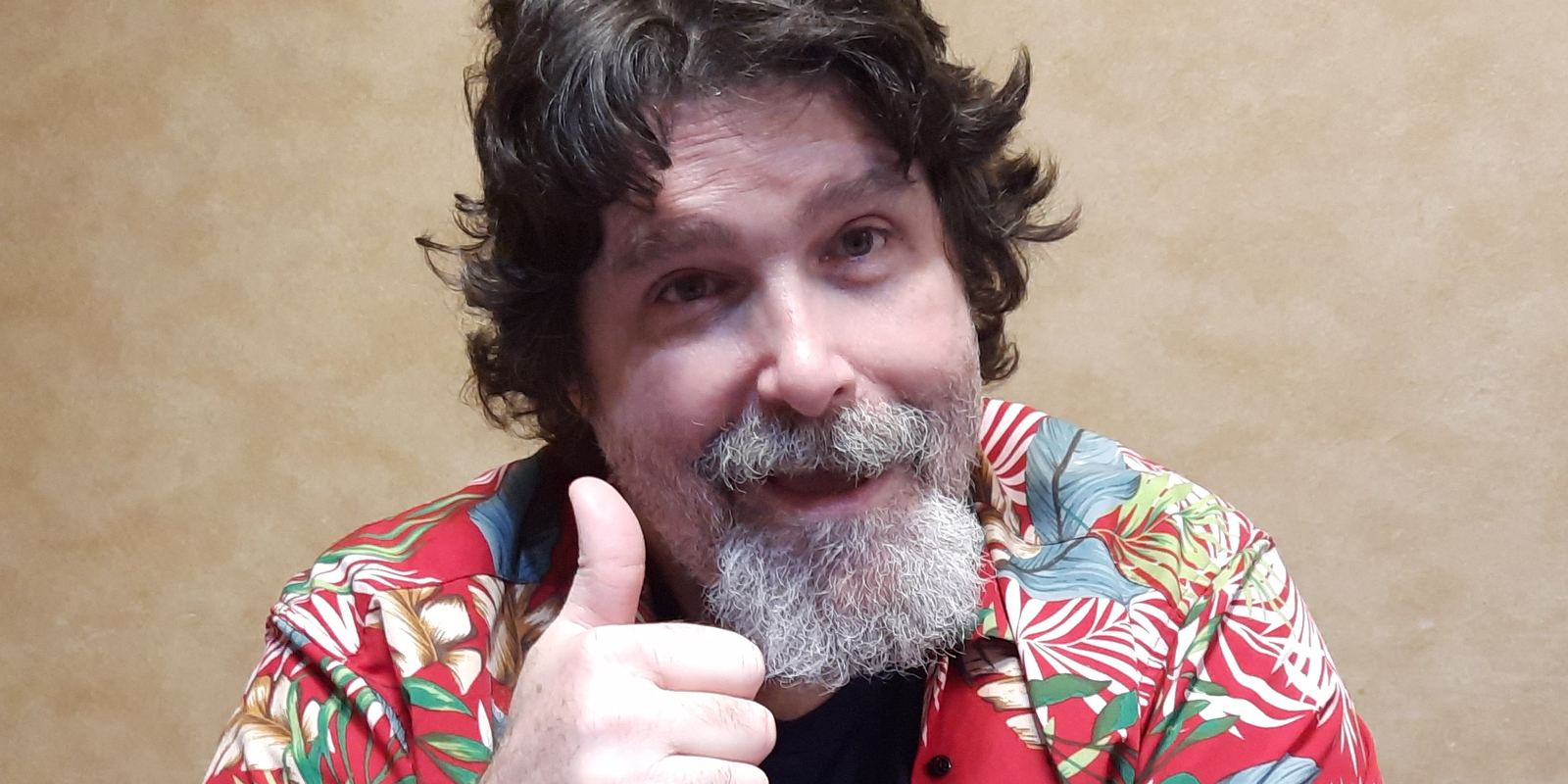 Mick Foley with his long hair and beard in 2024