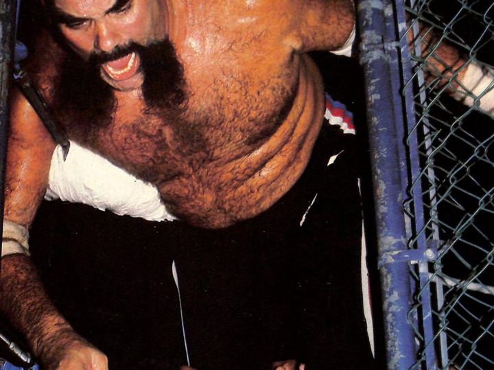 Ox Baker and Jose Gonzalez fighting inside a steel cage around 1983
