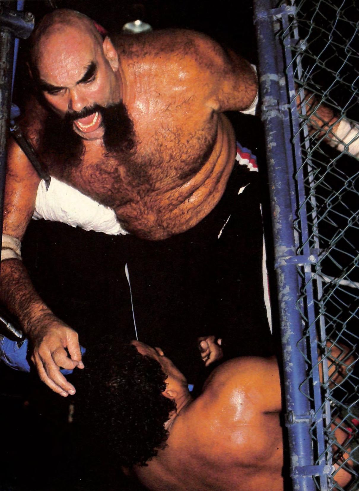 Ox Baker and Jose Gonzalez fighting inside a steel cage around 1983