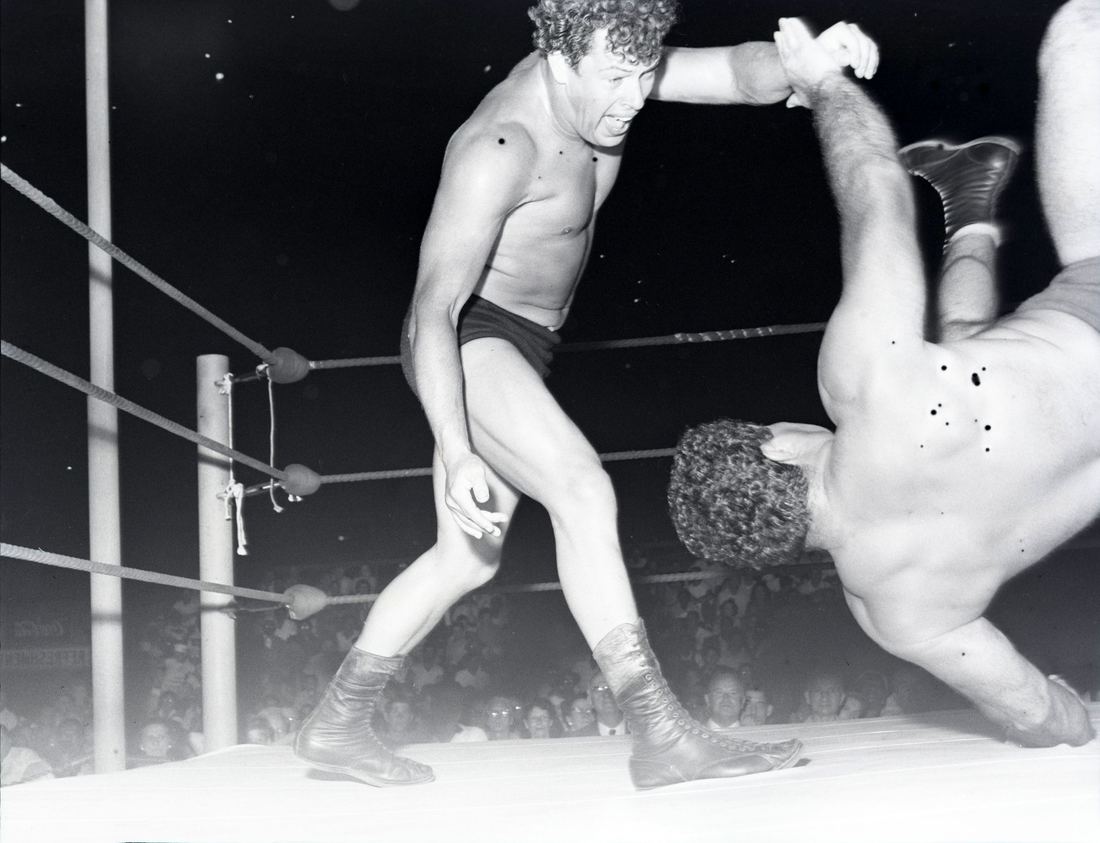 Crowd watching a wrestling show at Haft's Acre, an outdoor arena in Columbus, Ohio, in 1958